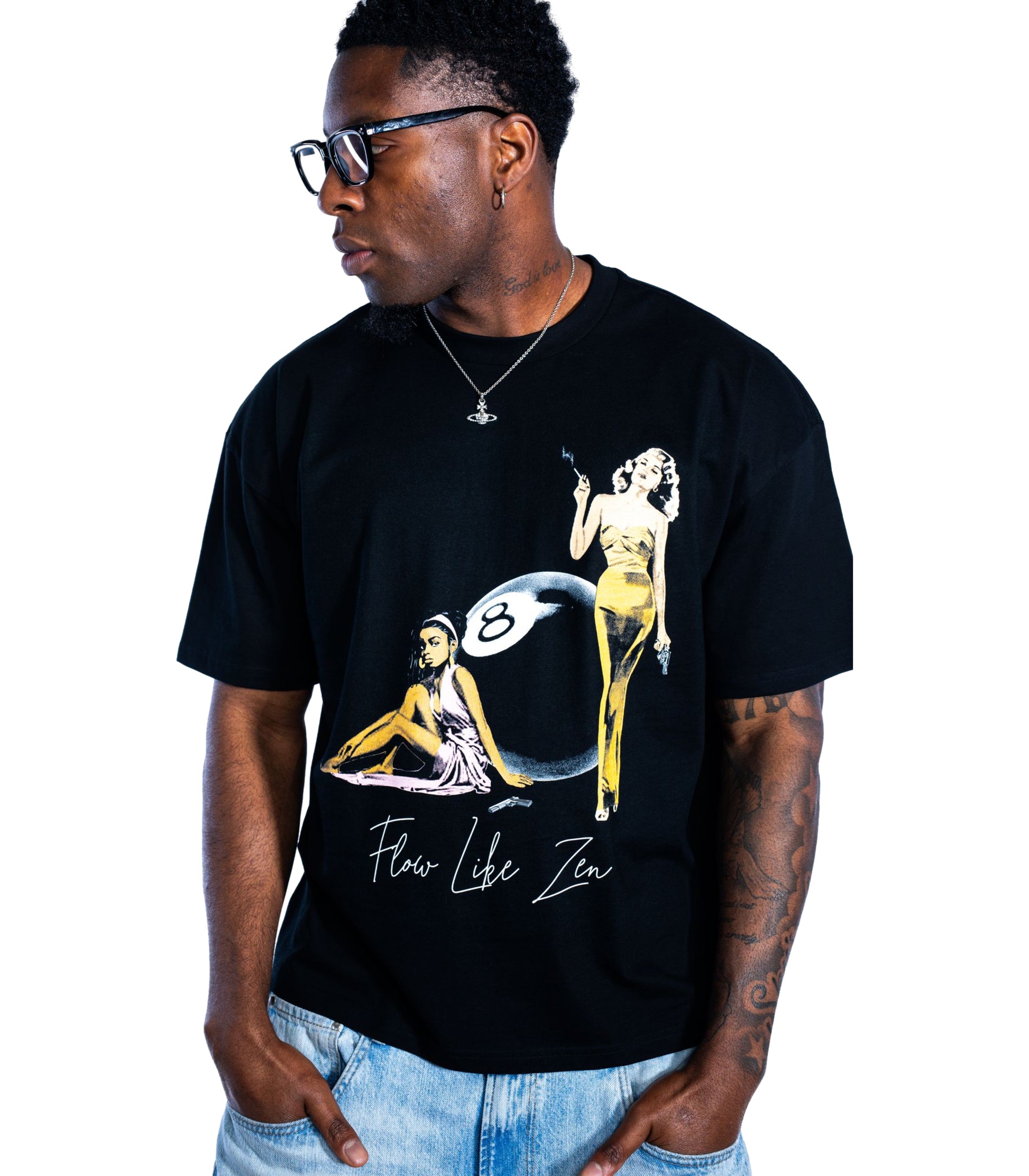 Male model wearing Flow Like Zen black t-shirt featuring retro eight ball graphic print – premium British streetwear fashion.