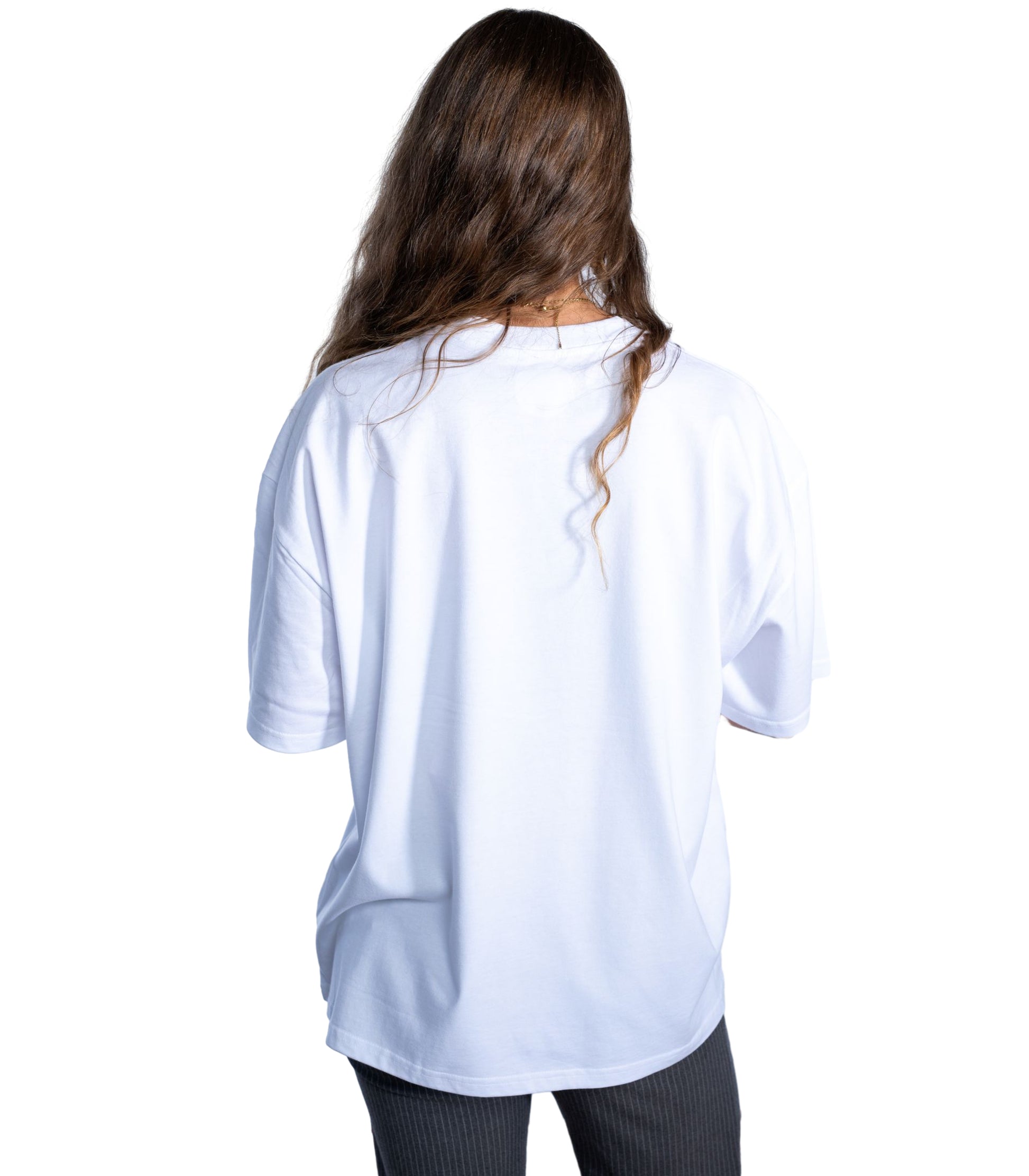 Back view of woman wearing Flow Like Zen white t-shirt – independent British urban streetwear.