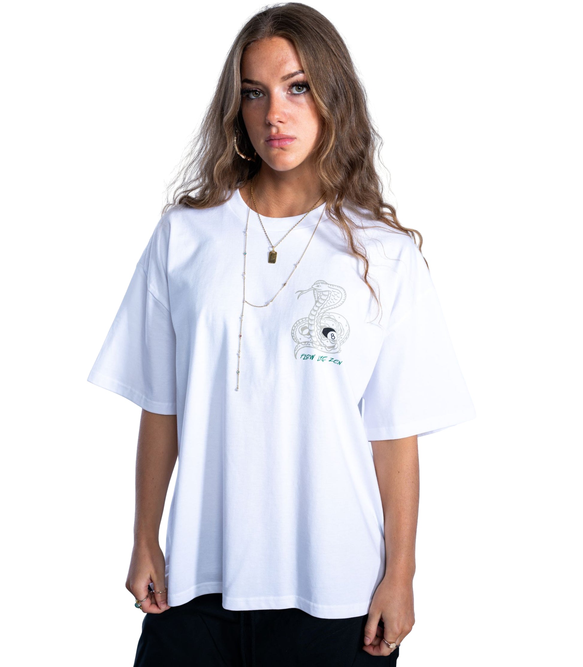 Person wearing a white t-shirt with a graphic design on a plain background