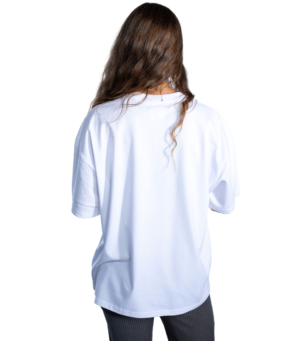 Back view of woman wearing Flow Like Zen white t-shirt – independent British urban streetwear.